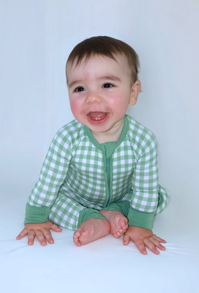 Baby wearing the Goodnight Goose green gingham bamboo zipper romper.