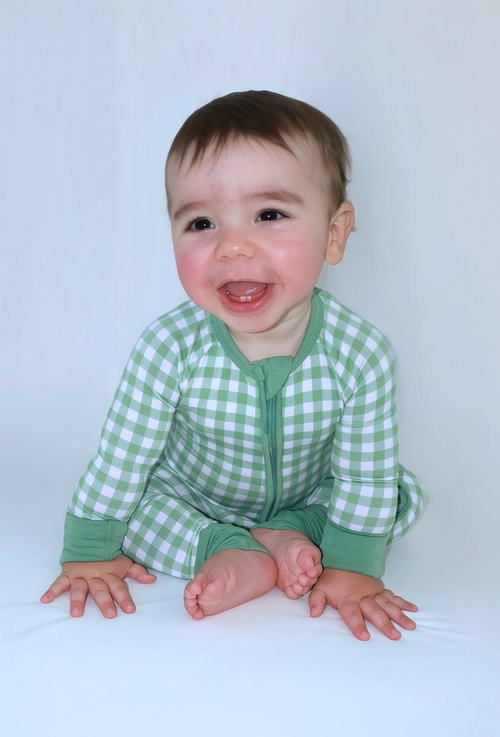 Baby wearing the Goodnight Goose green gingham bamboo zipper romper.